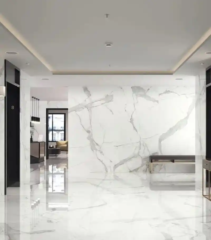 Statuario marble slab with bold grey veining on white surface